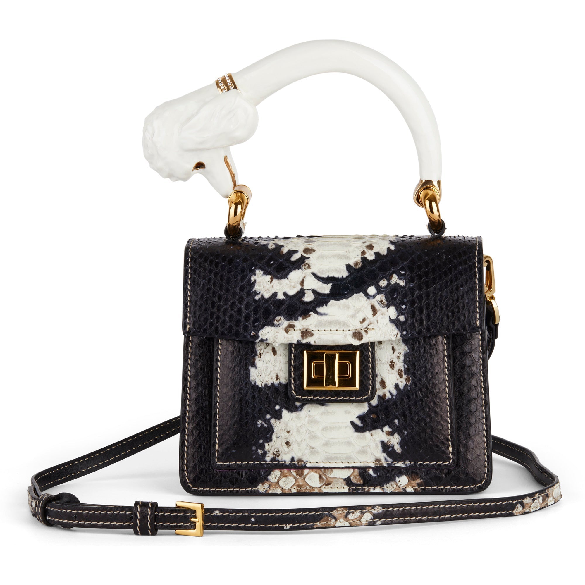 Black and white genuine python leather mini handbag with sculpted ivory top handle, gold hardware, and adjustable crossbody strap.