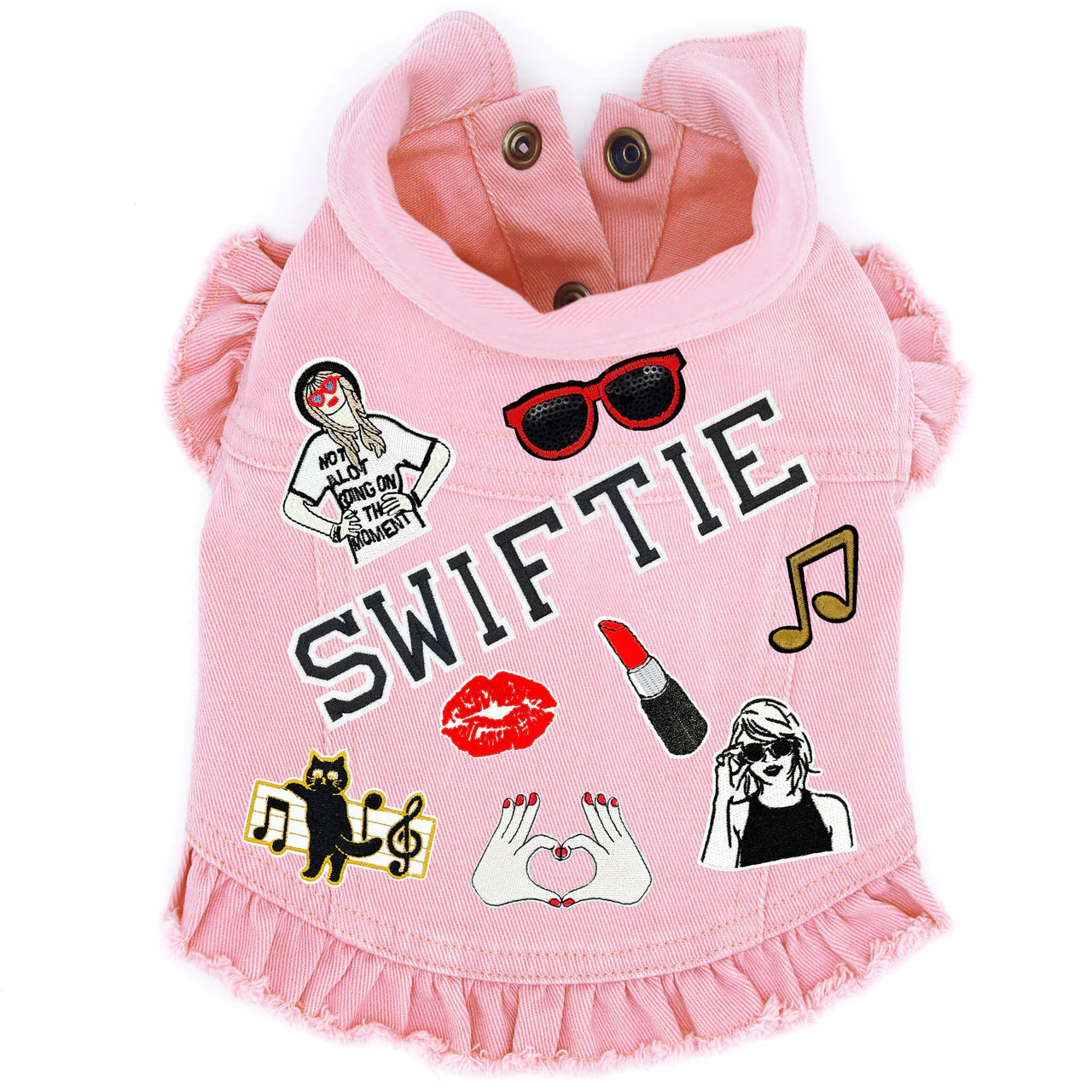 Pink Swiftie-inspired denim dog harness vest with playful patches, ruffled hem, perfect for trendy pet fashion.