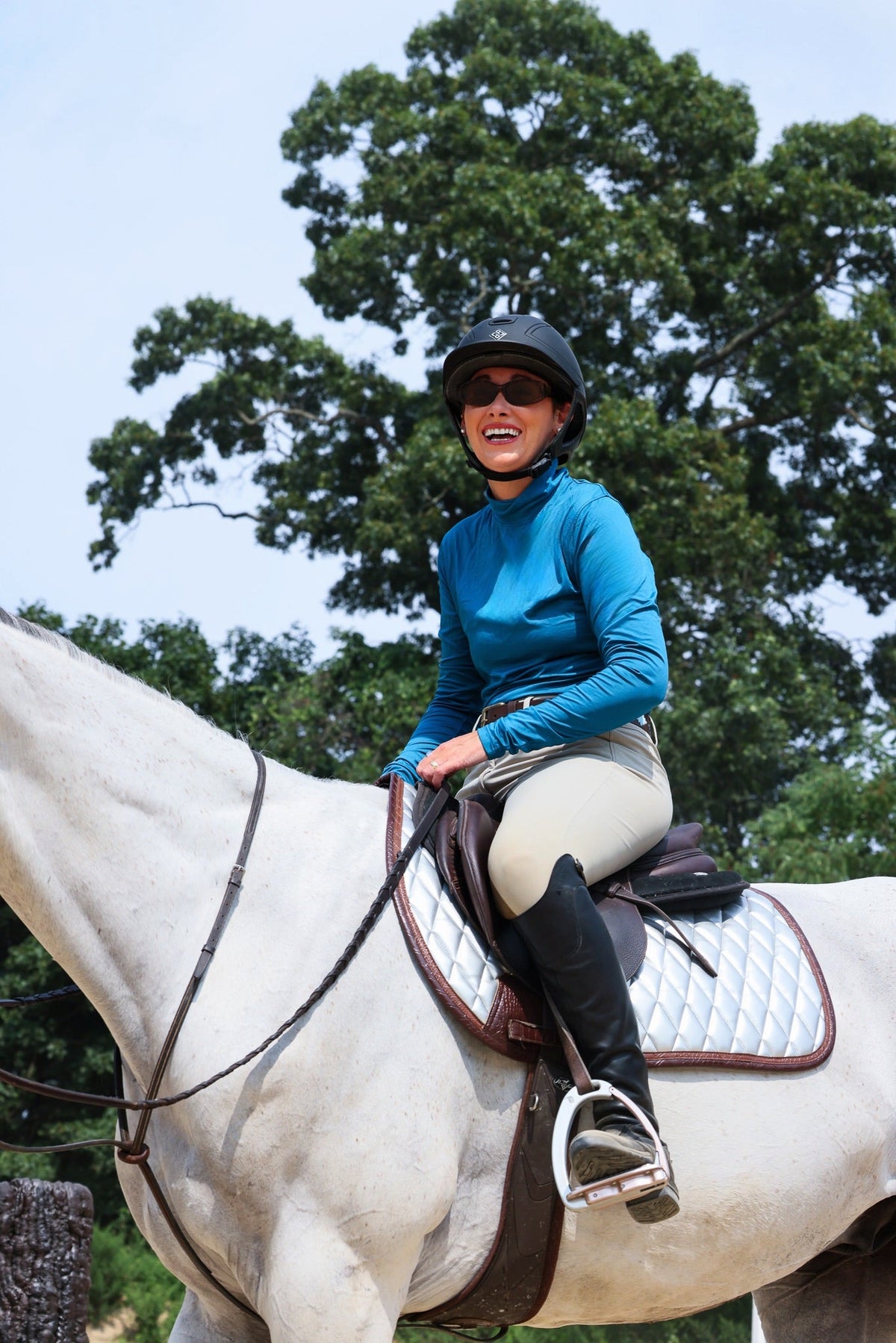 San Eligius chrome quilted jump saddle pad with brown crocodile piping, top-down view