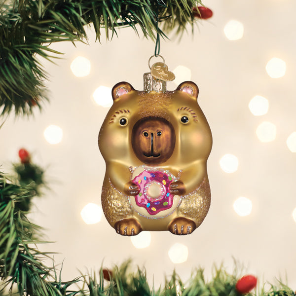Old World Christmas: Capybara Eating Donut Christmas Ornament