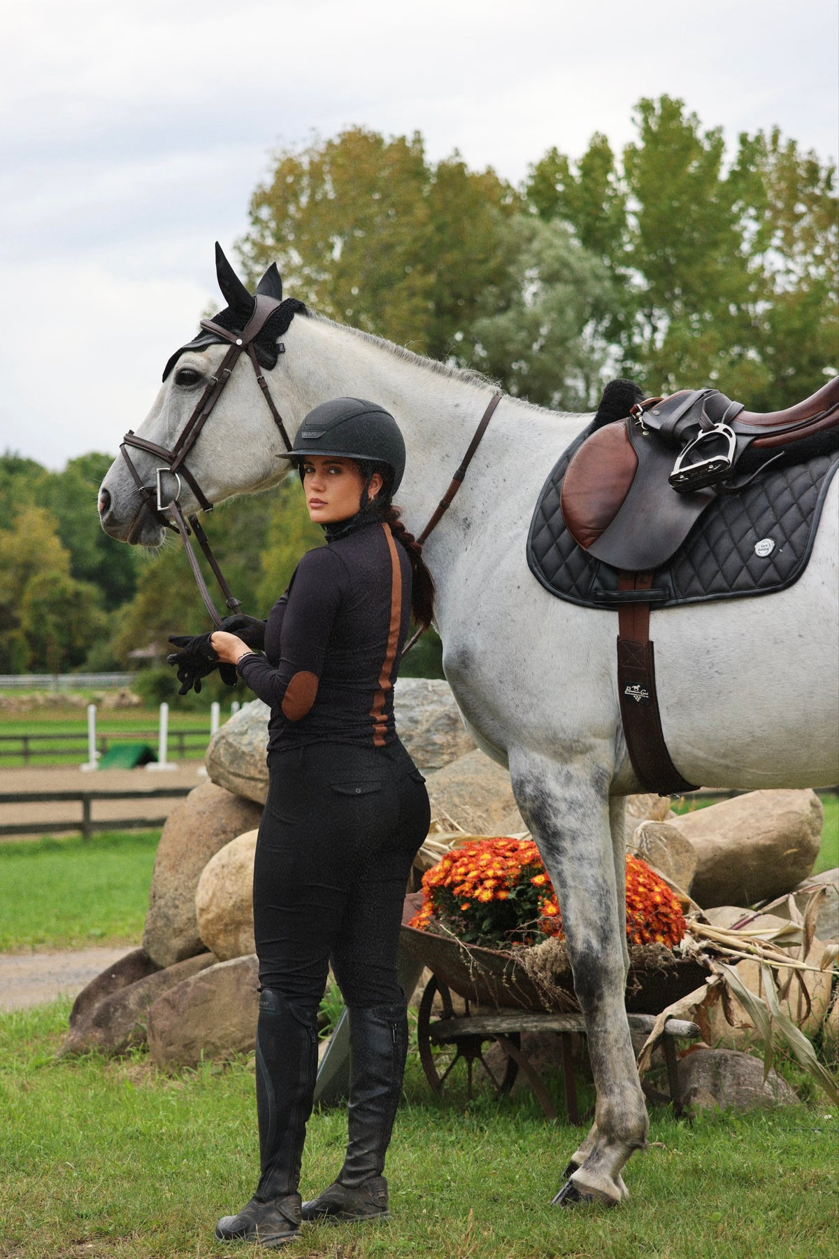 San Eligius black Blair riding top, turtleneck with elbow patches, back view showing stripe detail