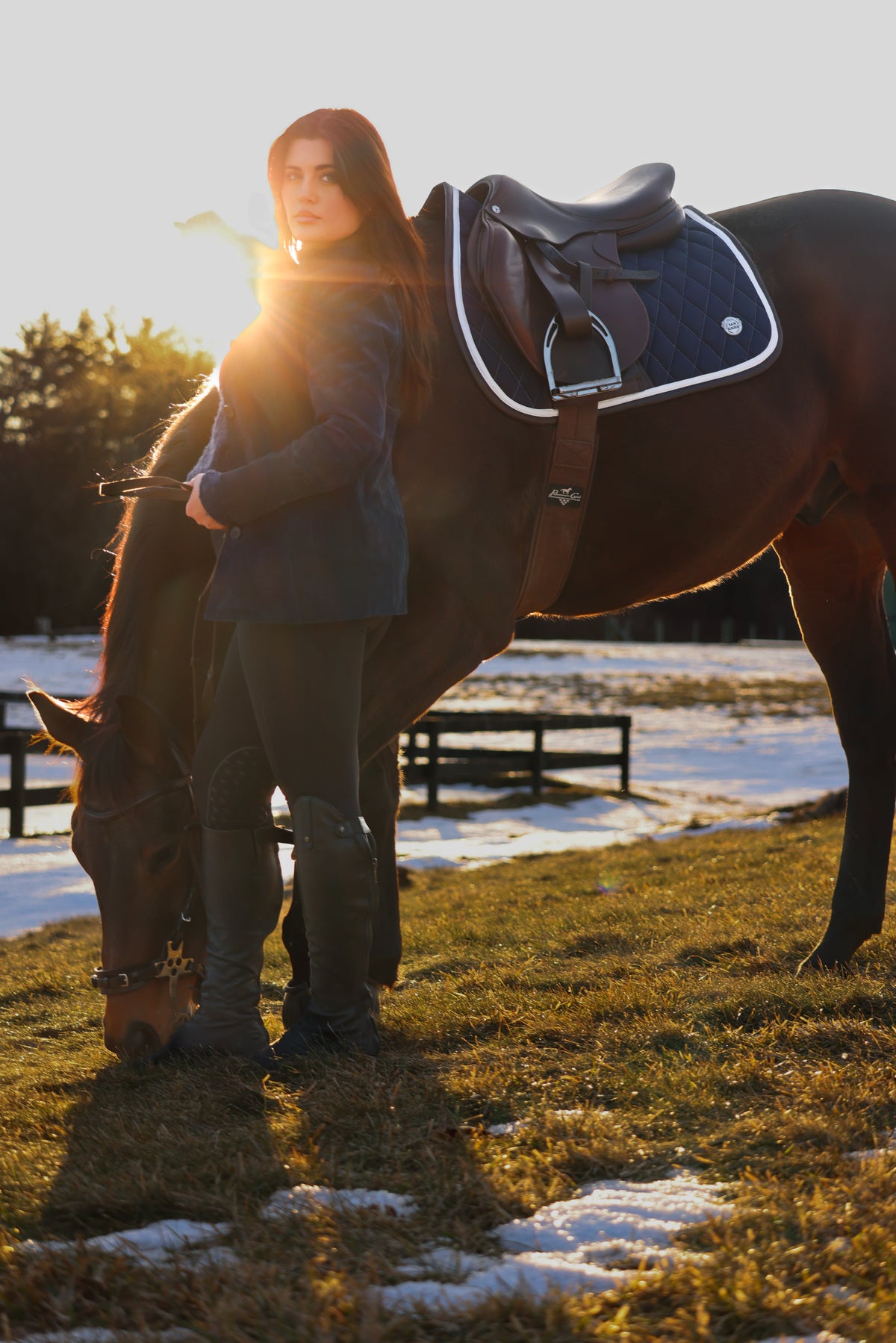 San Eligius navy quilted jump saddle pad with white and brown leather piping, quilted texture detail