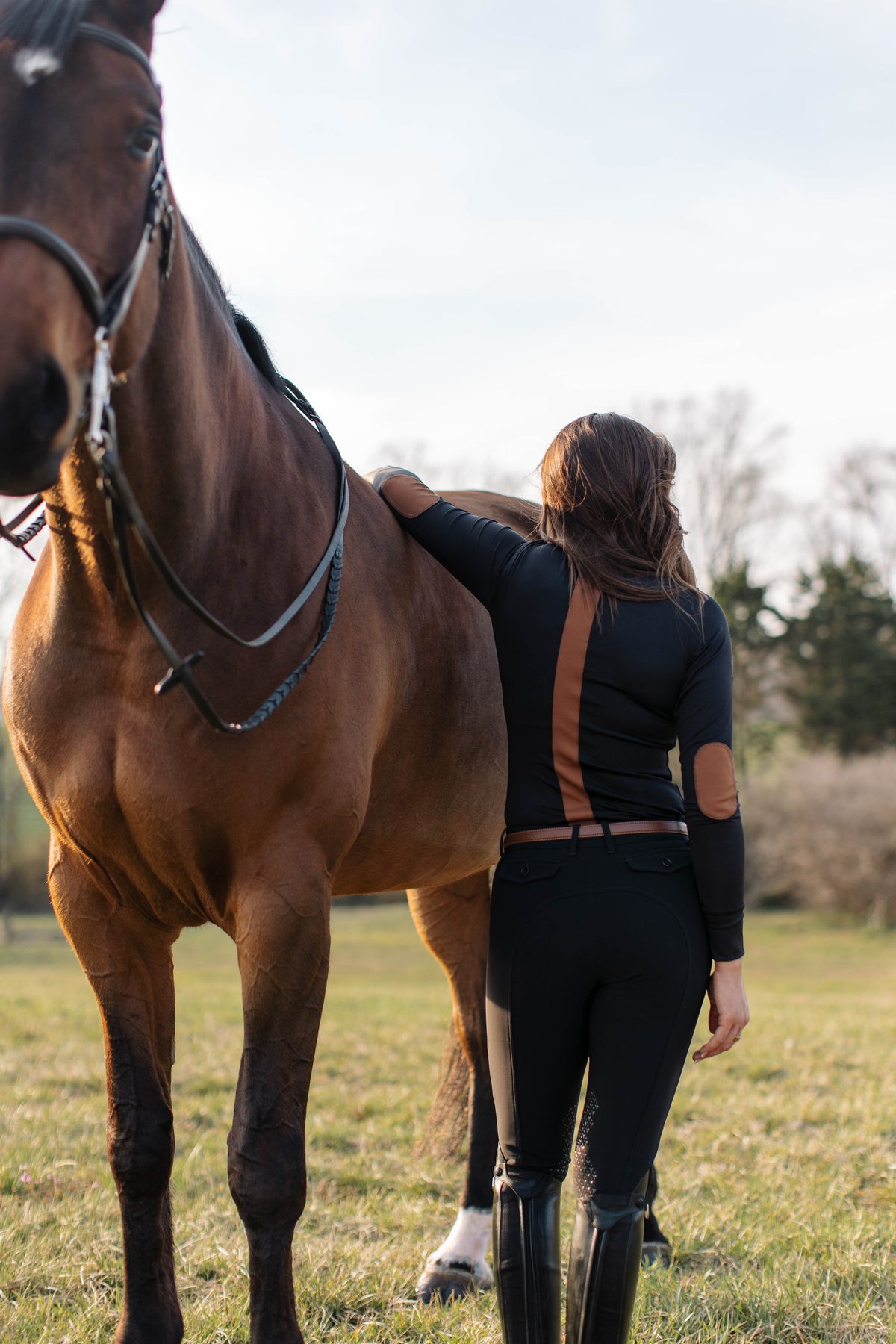 San Eligius black Blair riding top, turtleneck with elbow patches on model