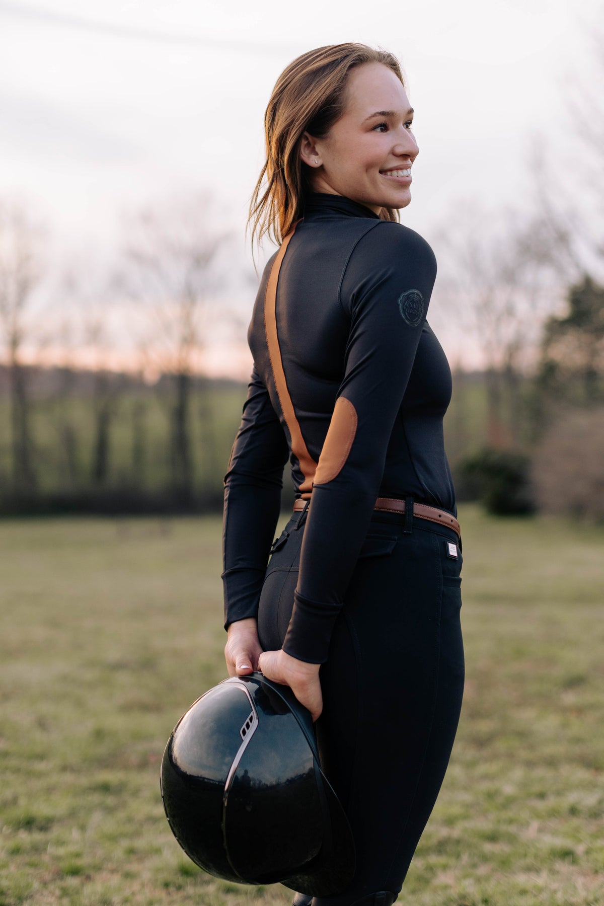 San Eligius black Blair riding top, turtleneck with elbow patches on model