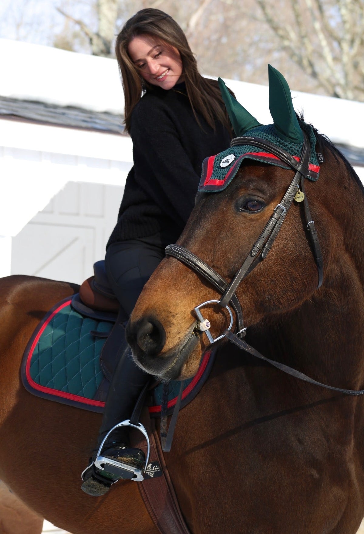 San Eligius green quilted jump saddle pad with red and brown leather piping, flat lay front view