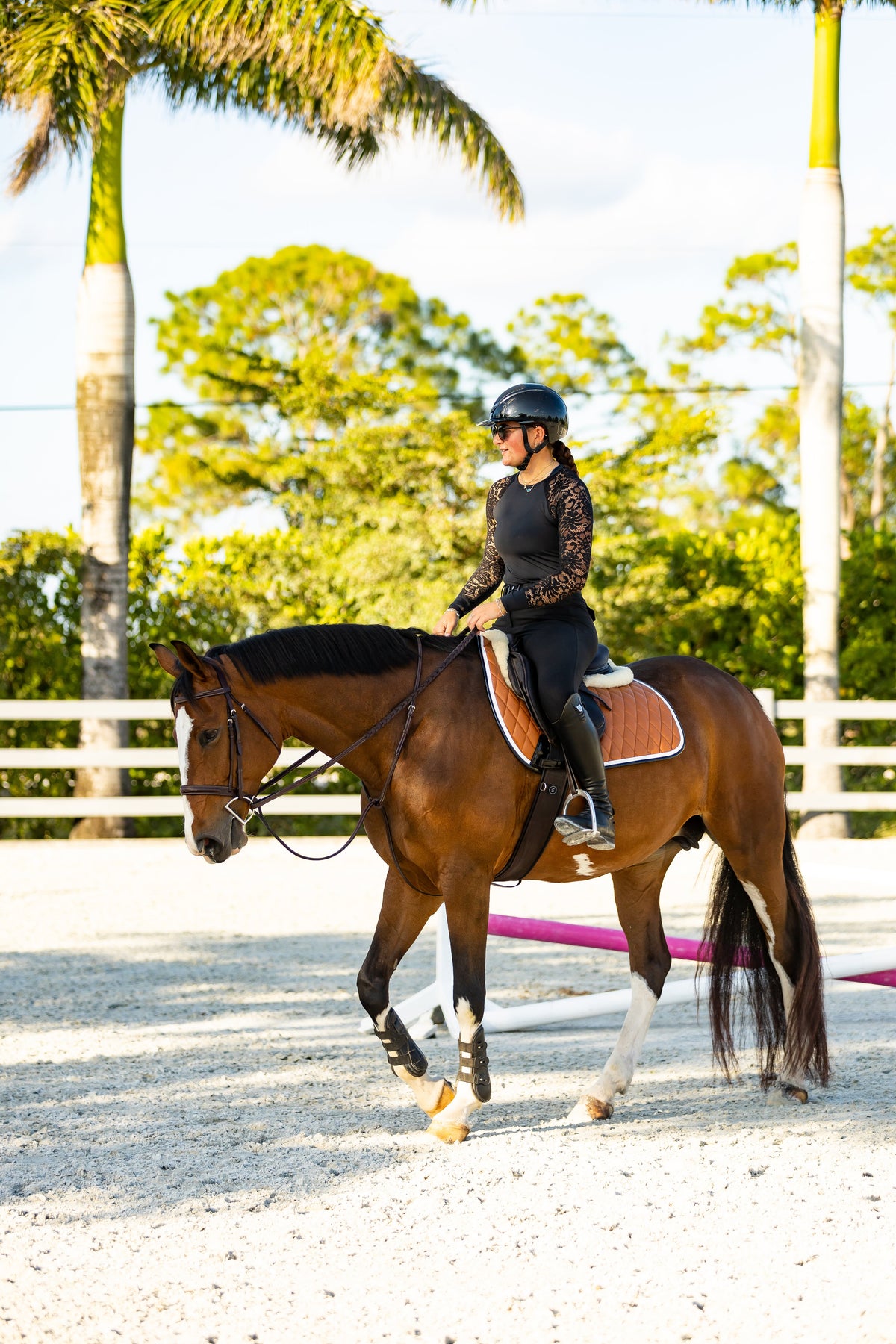 San Eligius cognac quilted jump saddle pad with white and black crocodile piping, close-up of piping detail
