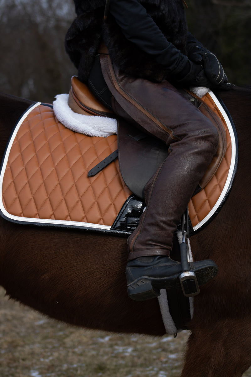 San Eligius cognac quilted jump saddle pad with white and black crocodile piping
