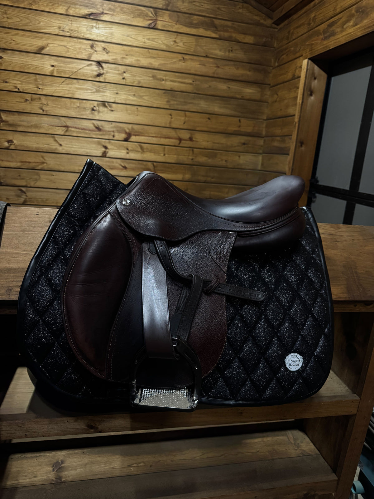 San Eligius Black Ice jump saddle pad with black leather piping
