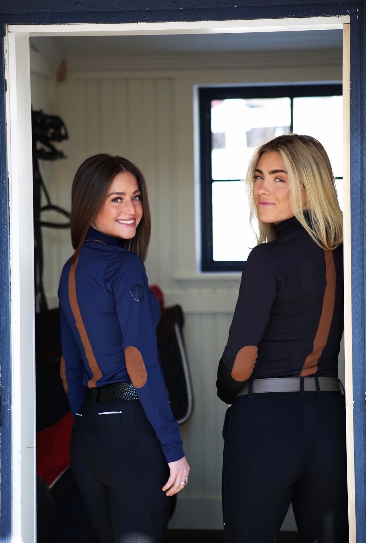 San Eligius navy Blair riding top, turtleneck with elbow patches, lifestyle shot outdoors