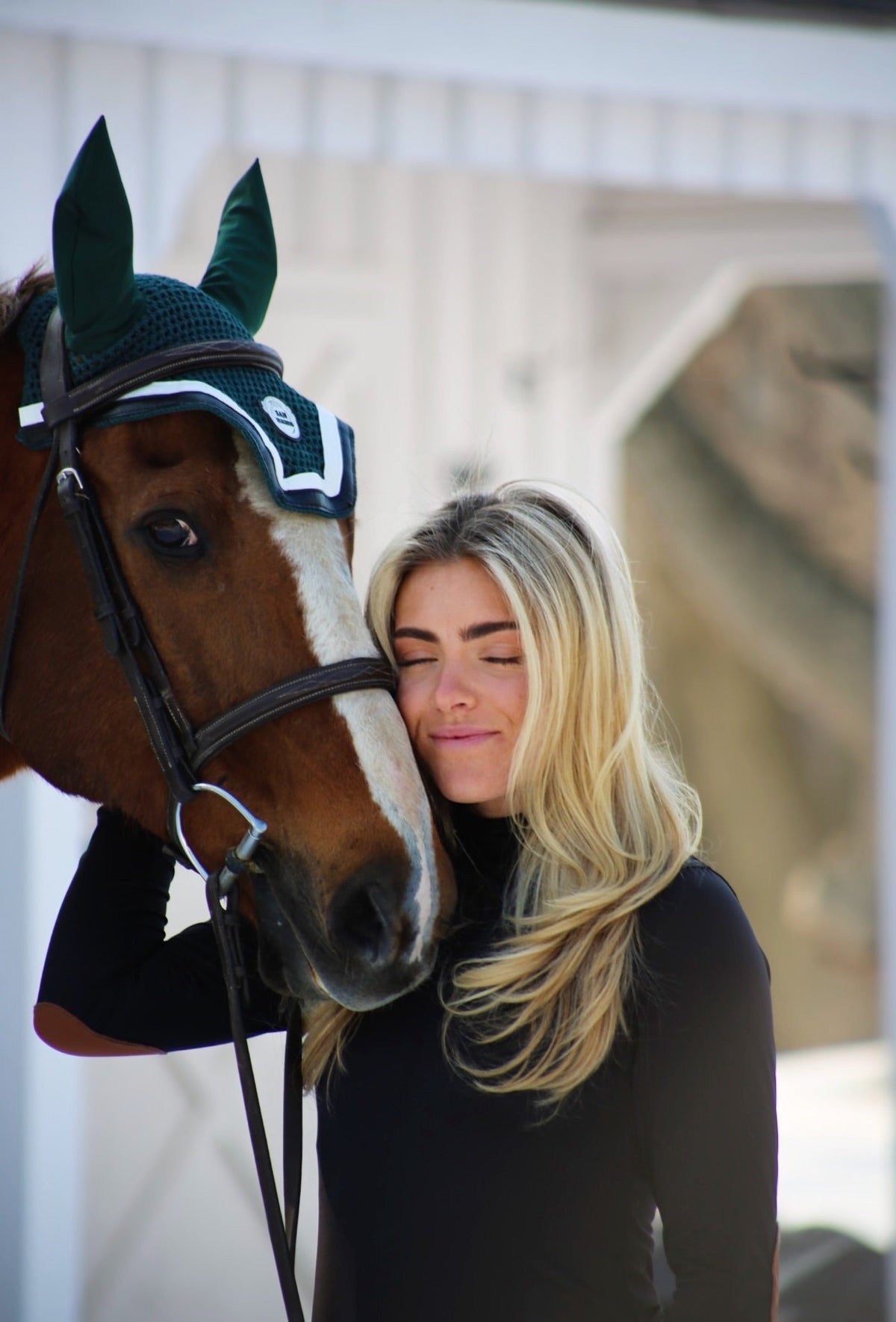 San Eligius green knit horse bonnet with black and white leather piping, San Eligius logo detail