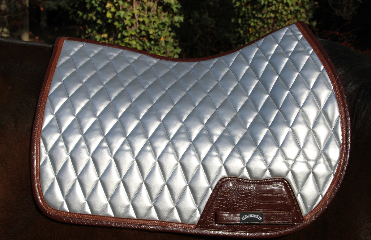 San Eligius chrome quilted jump saddle pad with brown crocodile piping, flat lay front view