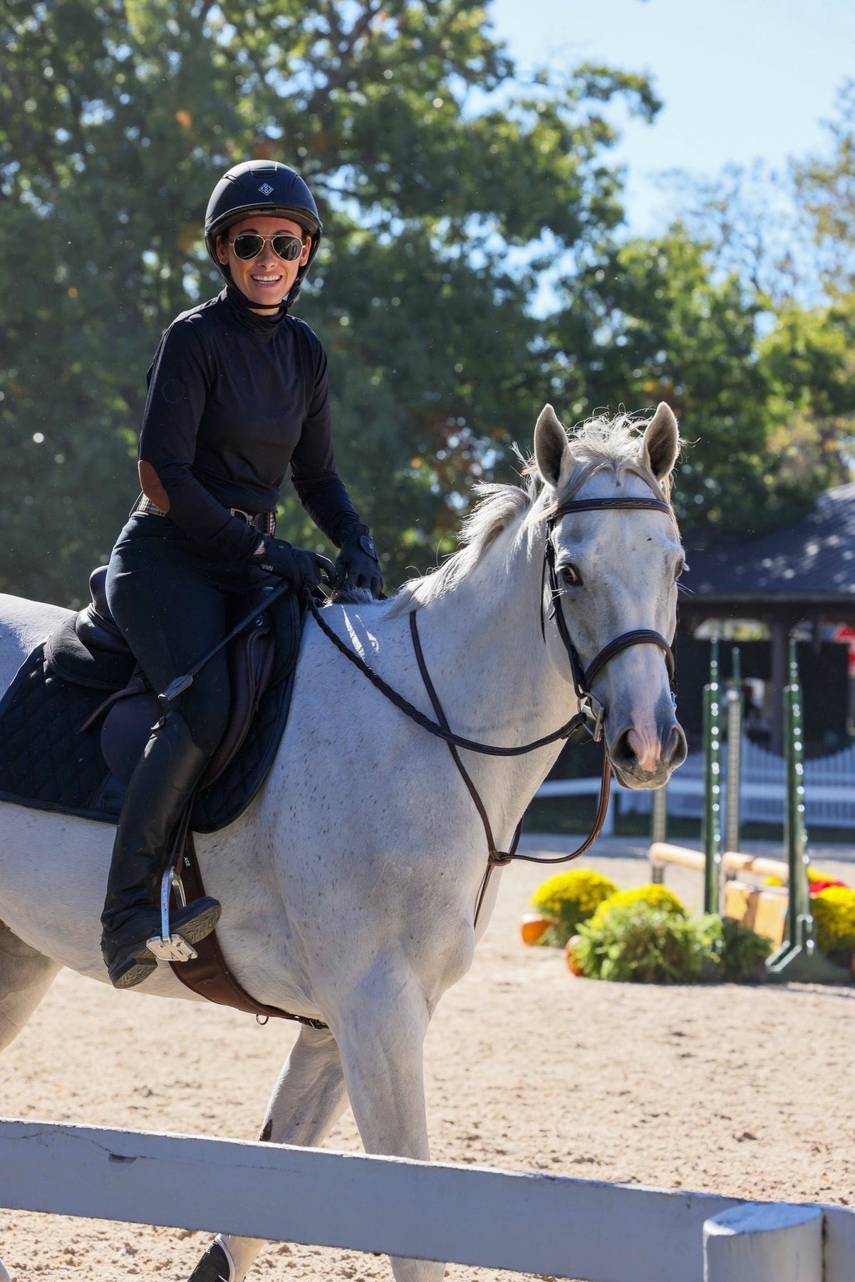 San Eligius black Blair riding top, turtleneck with elbow patches, lifestyle shot outdoors
