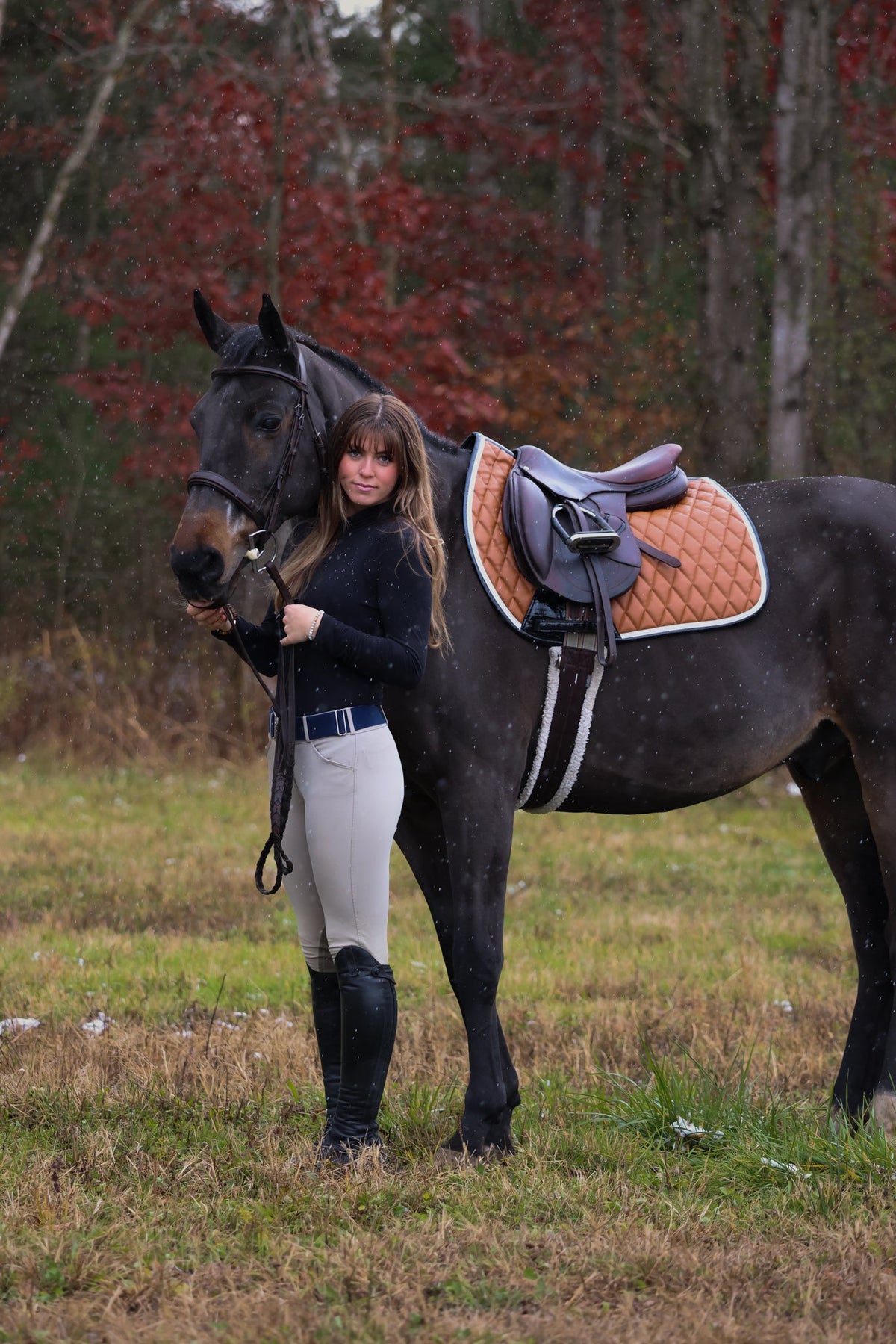 San Eligius cognac quilted jump saddle pad with white and black crocodile piping, lifestyle shot on horse