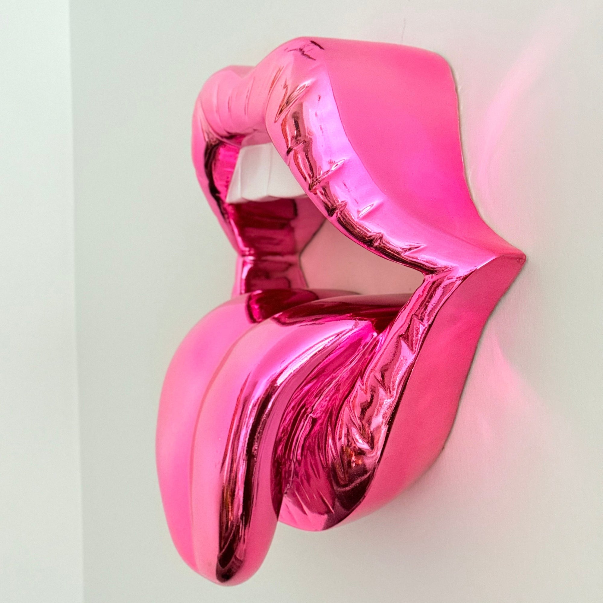 And Iconic Candy Pink Chrome Kiss Wall Sculpture