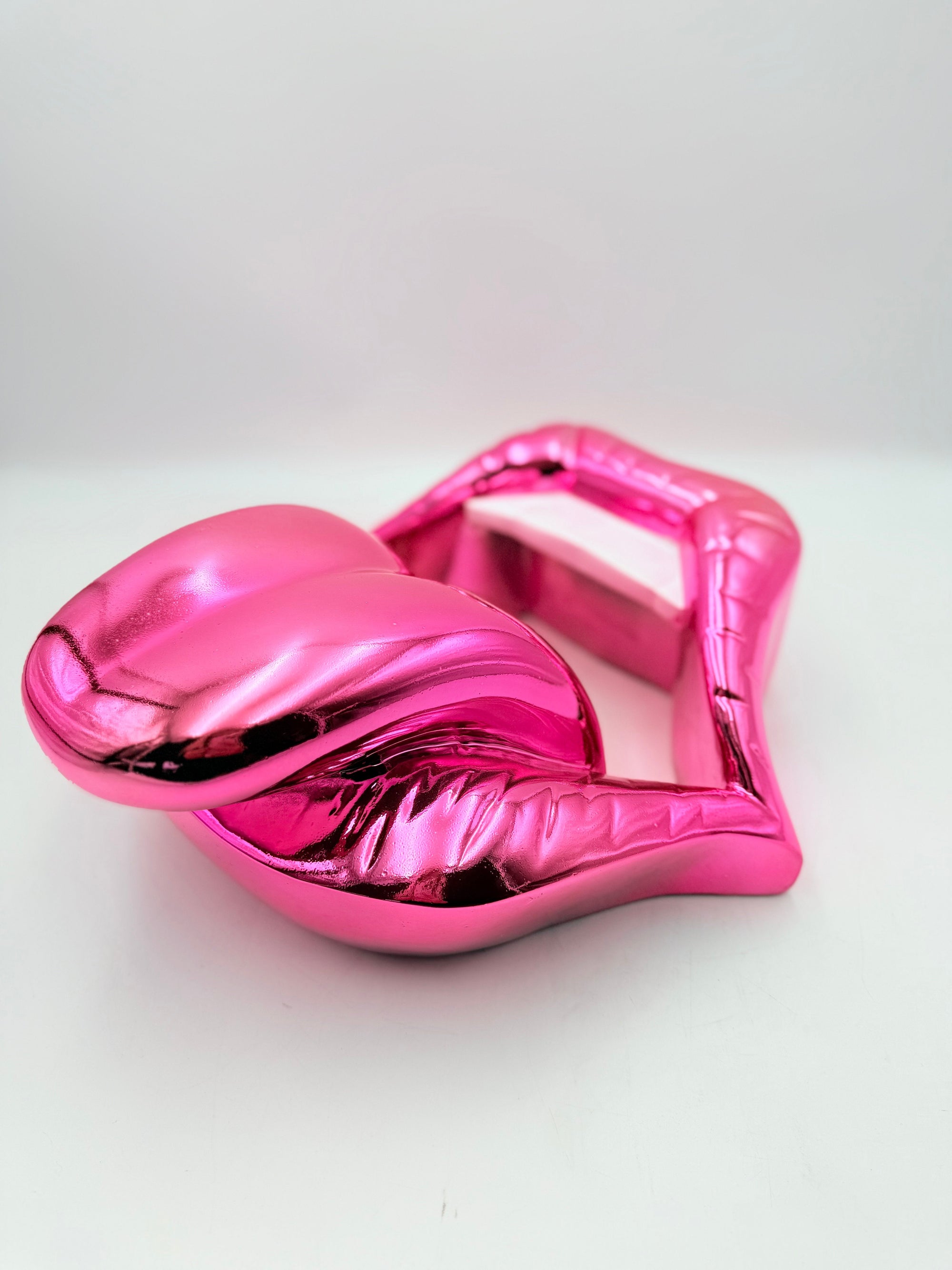 And Iconic Candy Pink Chrome Kiss Wall Sculpture