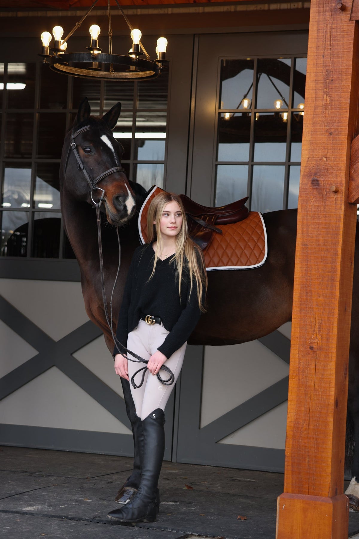 San Eligius cognac quilted jump saddle pad with white and black crocodile piping, close-up of wither relief