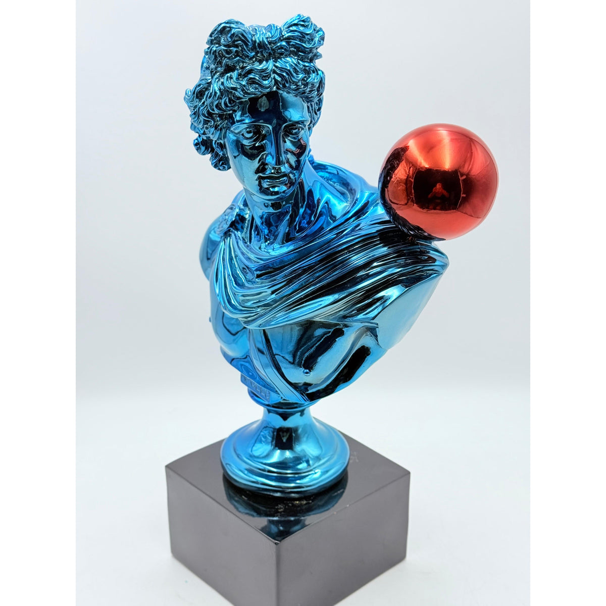 And Iconic Apollo Sculpture Blue Chrome with Red Balloon