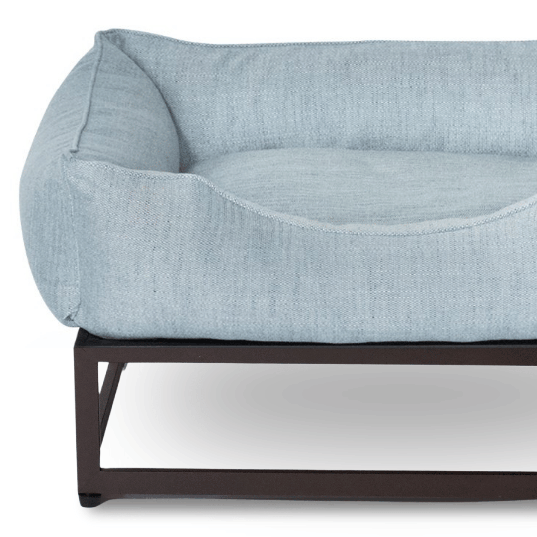 FÜZI Elevated Dog Bed in Mist Blue on brown metal base, base close-up