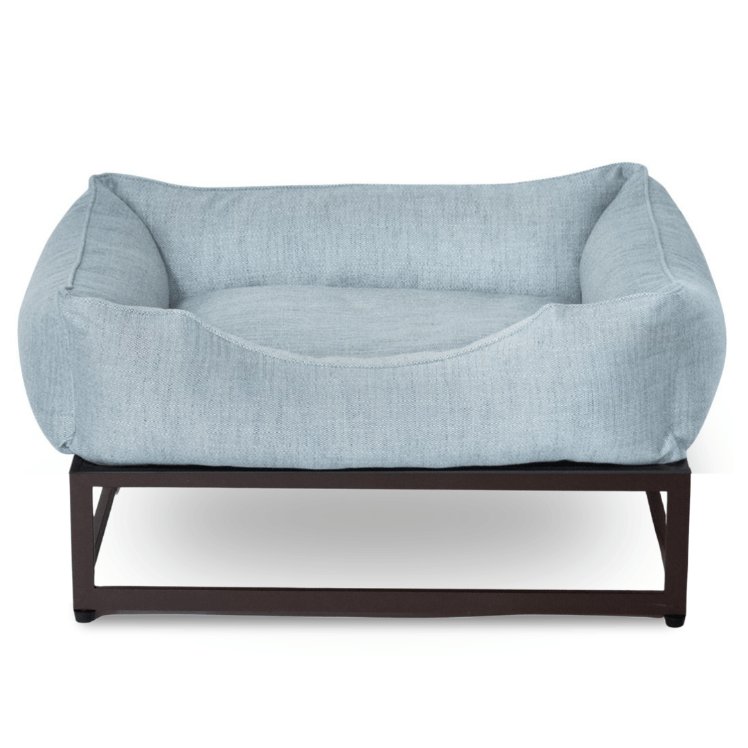 FÜZI Elevated Dog Bed in Mist Blue on brown metal base, back view