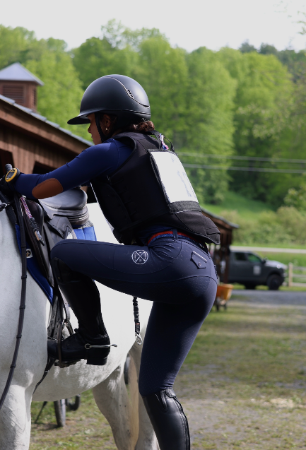 San Eligius navy Blair riding top, turtleneck with elbow patches, front view on model