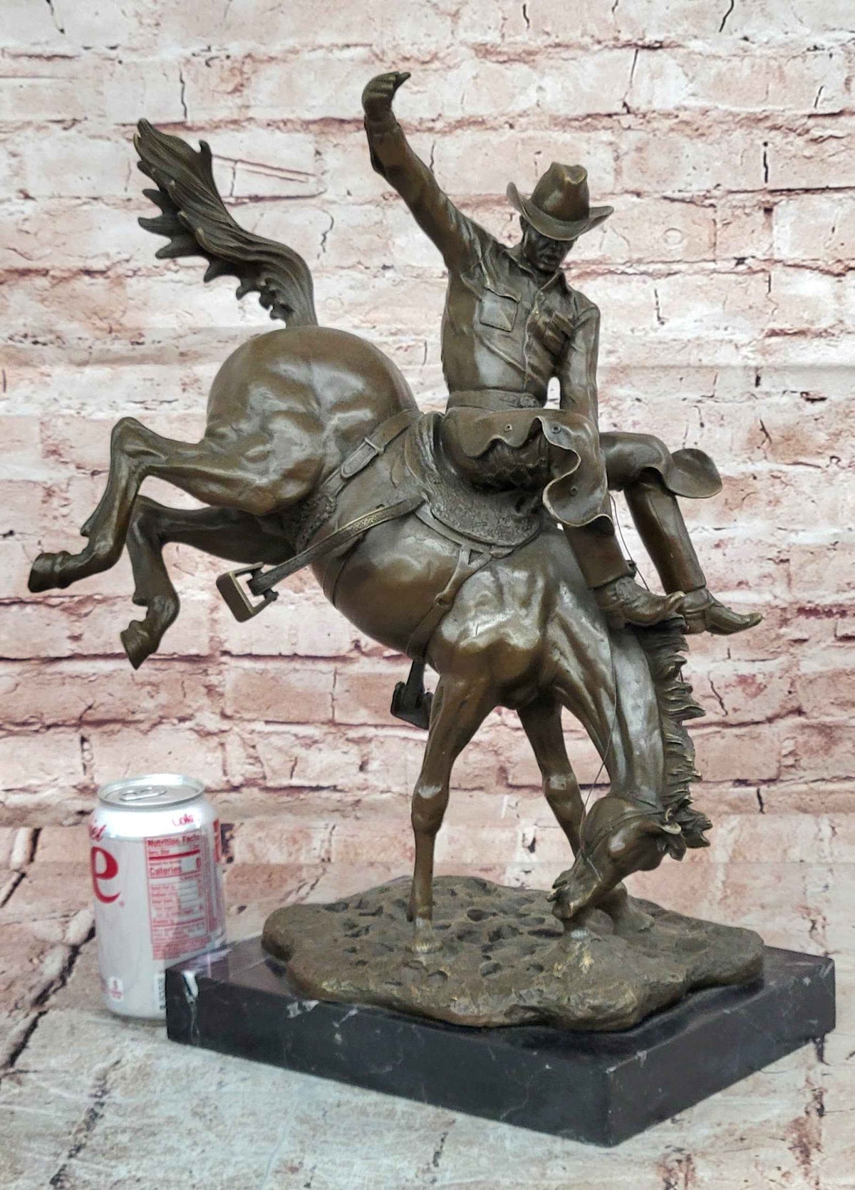 Bronze Sculpture Depicting a Cowboy on a Bucking Horse by Remington Art
