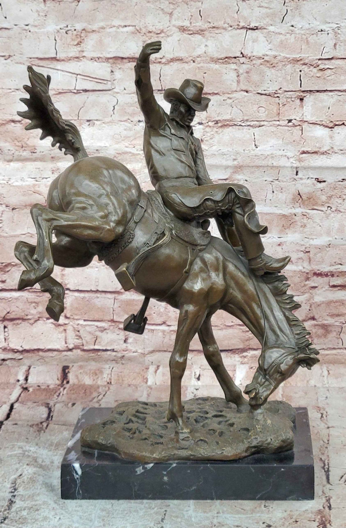 Bronze Sculpture Depicting a Cowboy on a Bucking Horse by Remington Art