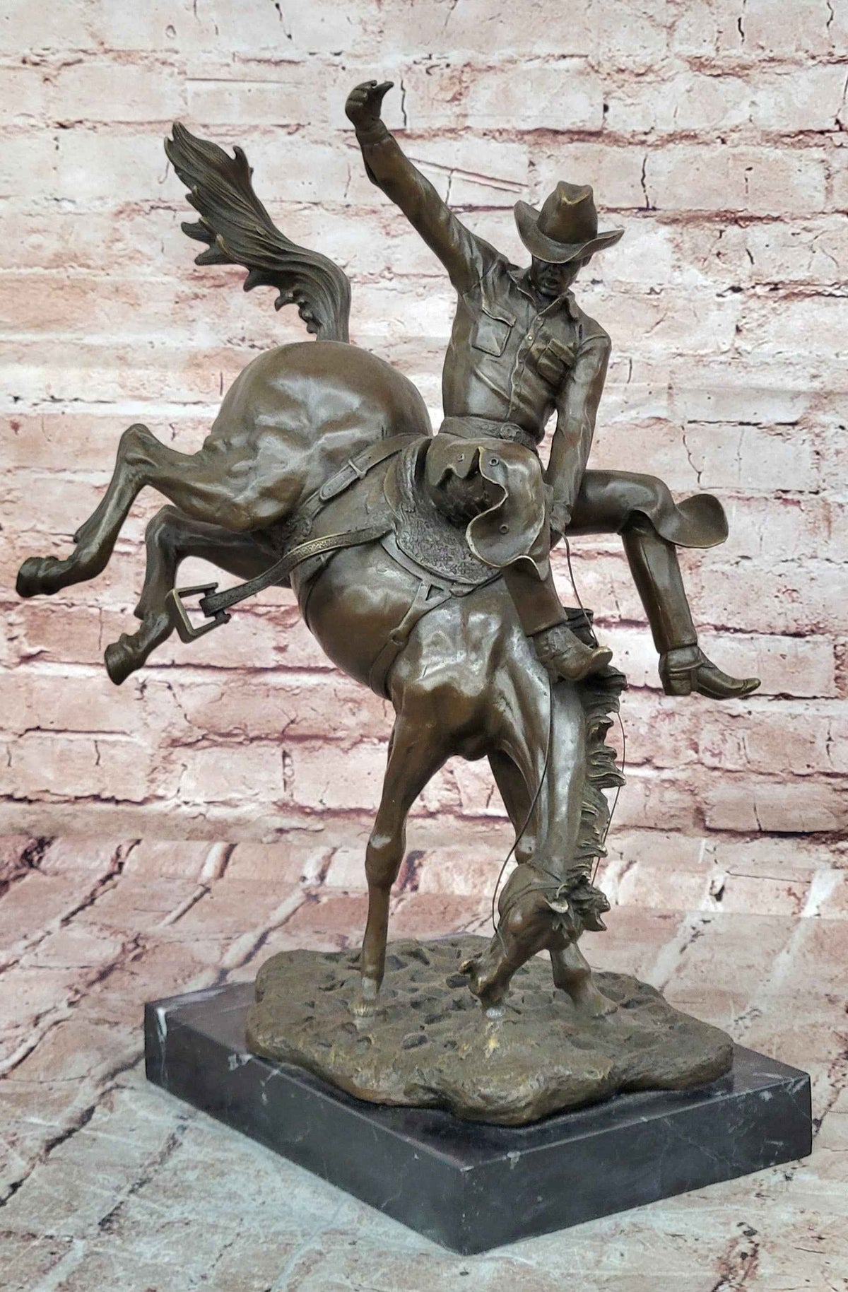 Bronze Sculpture Depicting a Cowboy on a Bucking Horse by Remington Art