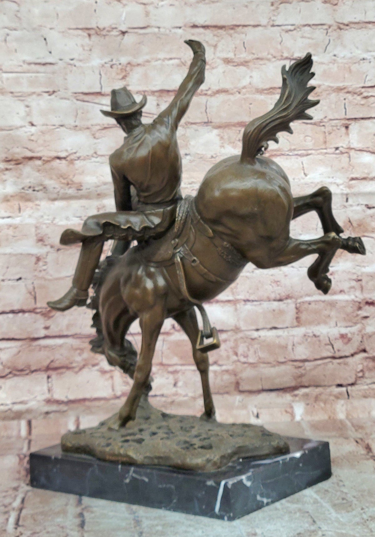 Bronze Sculpture Depicting a Cowboy on a Bucking Horse by Remington Art