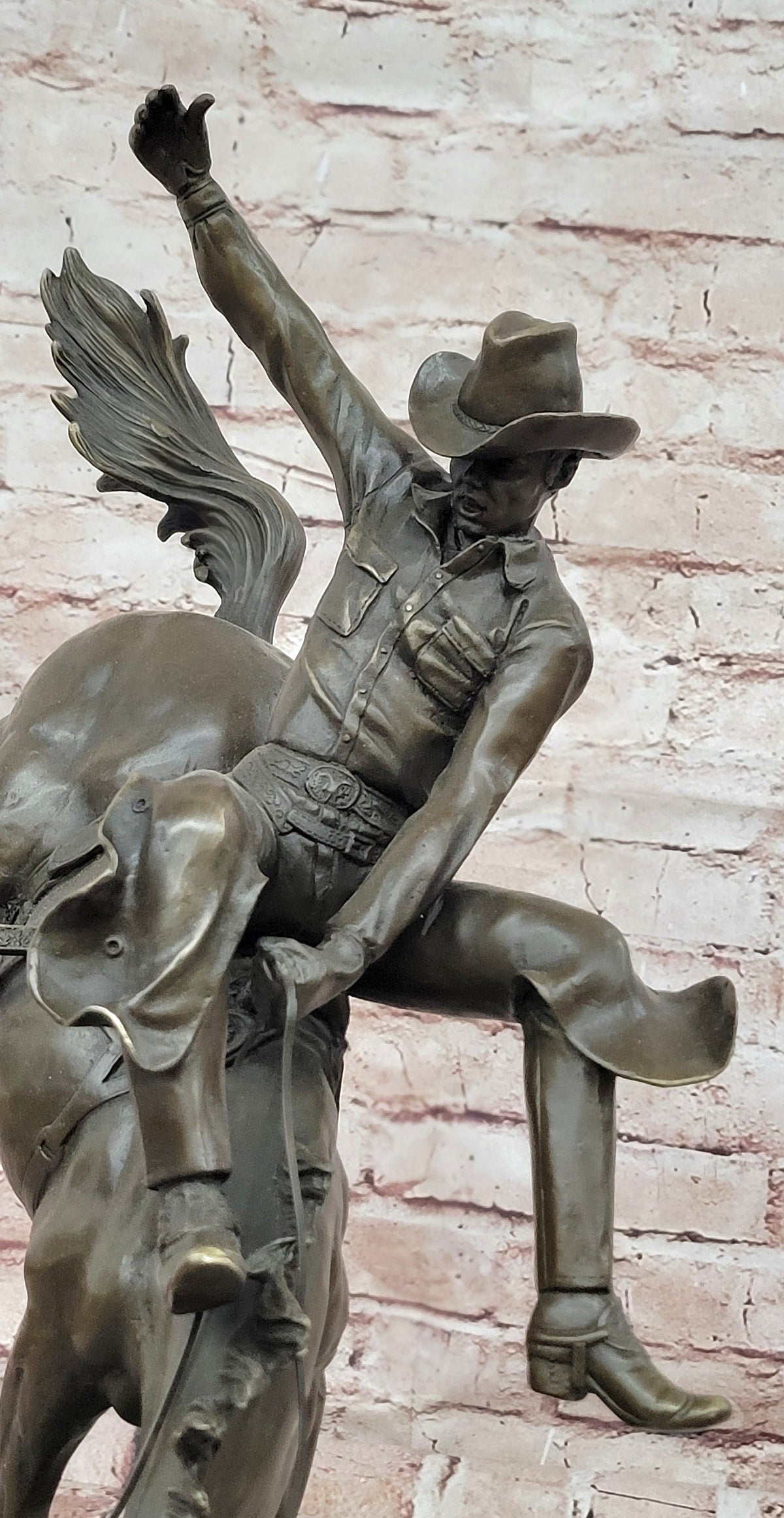Bronze Sculpture Depicting a Cowboy on a Bucking Horse by Remington Art