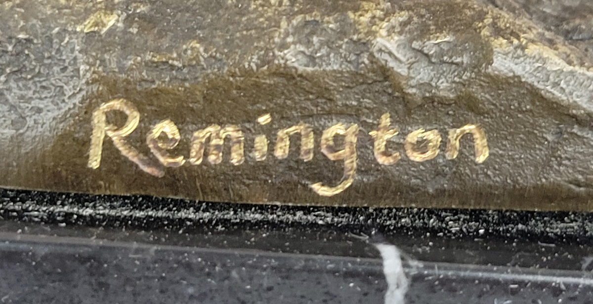 Bronze Sculpture Depicting a Cowboy on a Bucking Horse by Remington Art