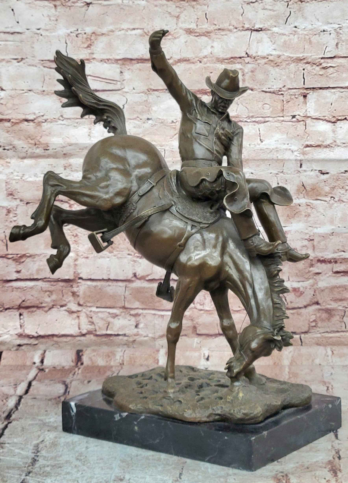 Bronze Sculpture Depicting a Cowboy on a Bucking Horse by Remington Art