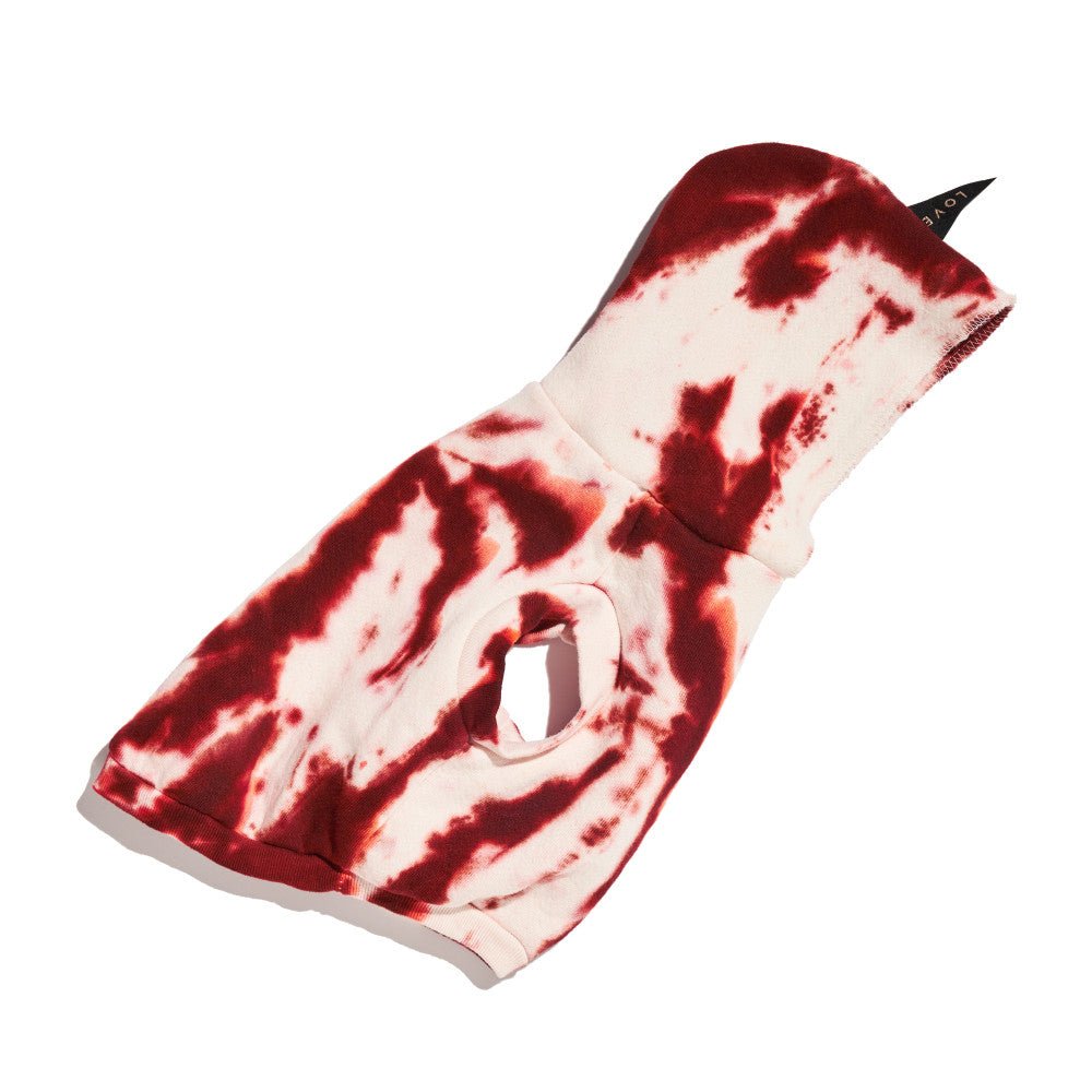 dog sweatshirt with paint splatter pattern, on white background